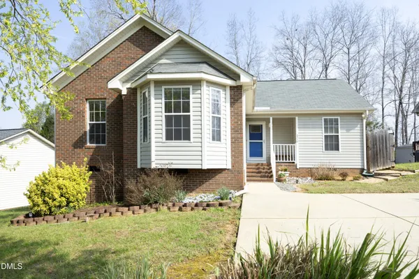 front view of a house with a yard