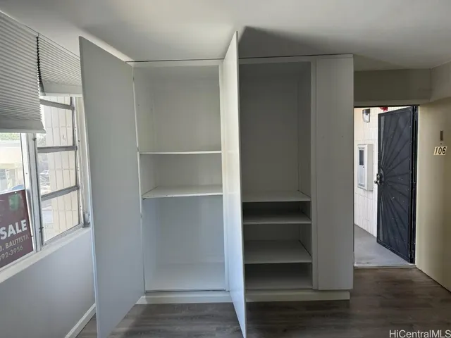a view of an empty walk in closet