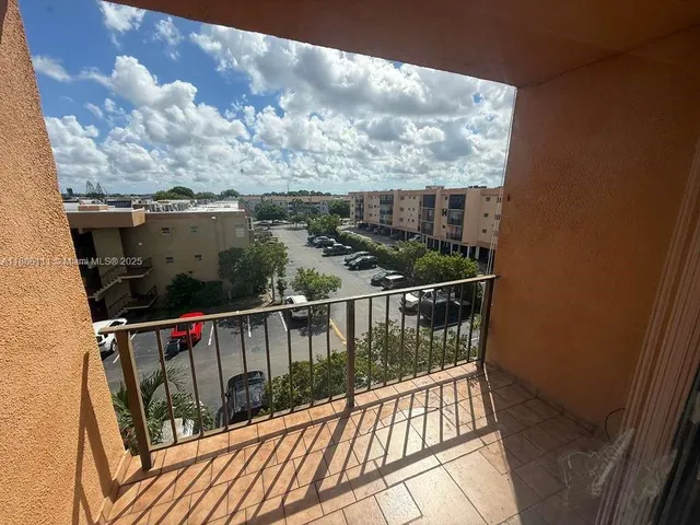 a view of balcony with furniture