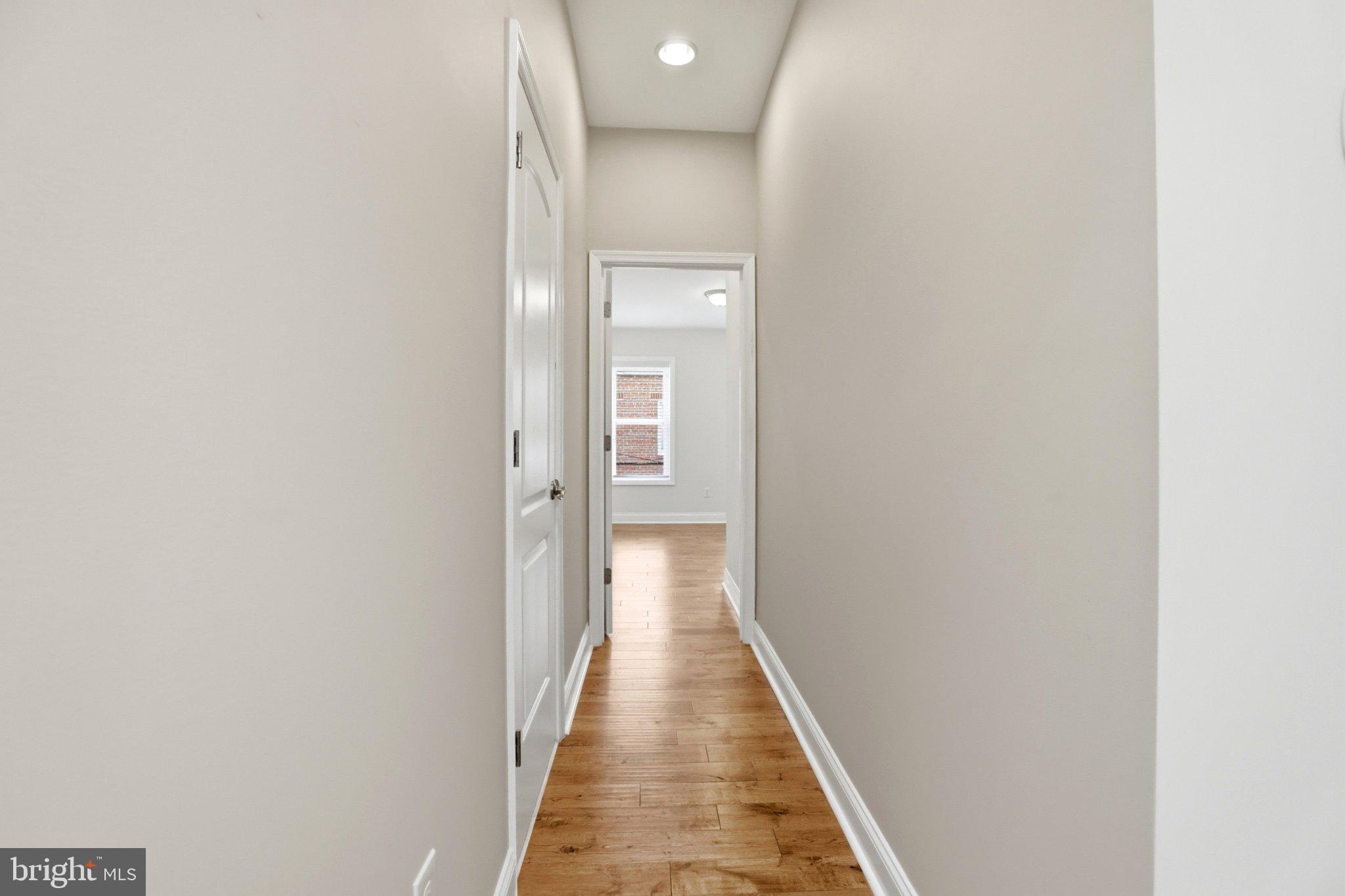 222 South Exeter Street Baltimore, MD 21202 - Photo 19 of 41 a view of a hallway with wooden floor