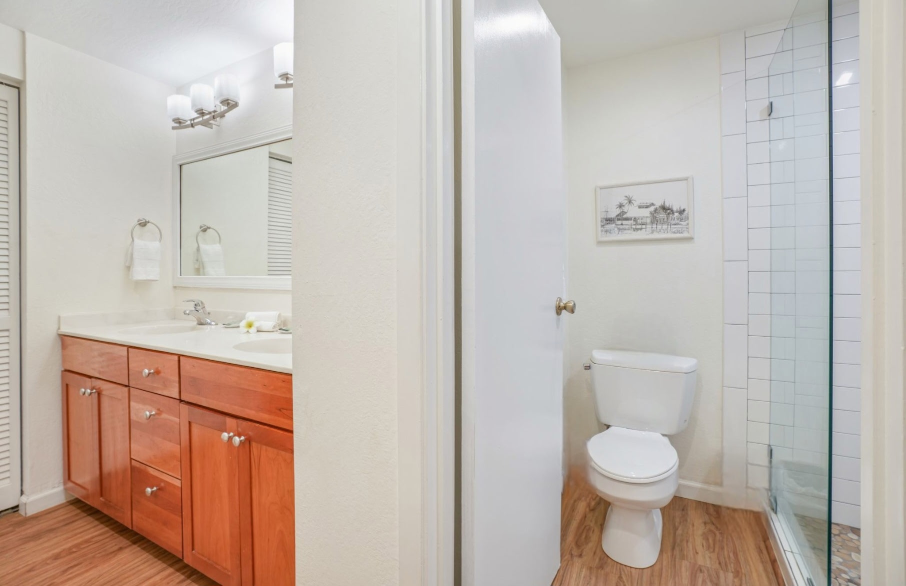 1901 Poipu Road, Unit 112 Koloa, HI 96756 - Photo 13 of 21 a spacious bathroom with a toilet sink and mirror