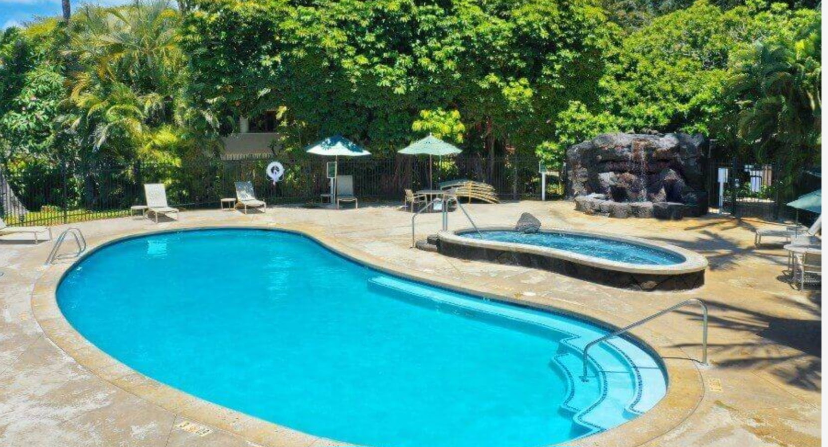 1901 Poipu Road, Unit 112 Koloa, HI 96756 - Photo 19 of 21 a view of a swimming pool with a patio