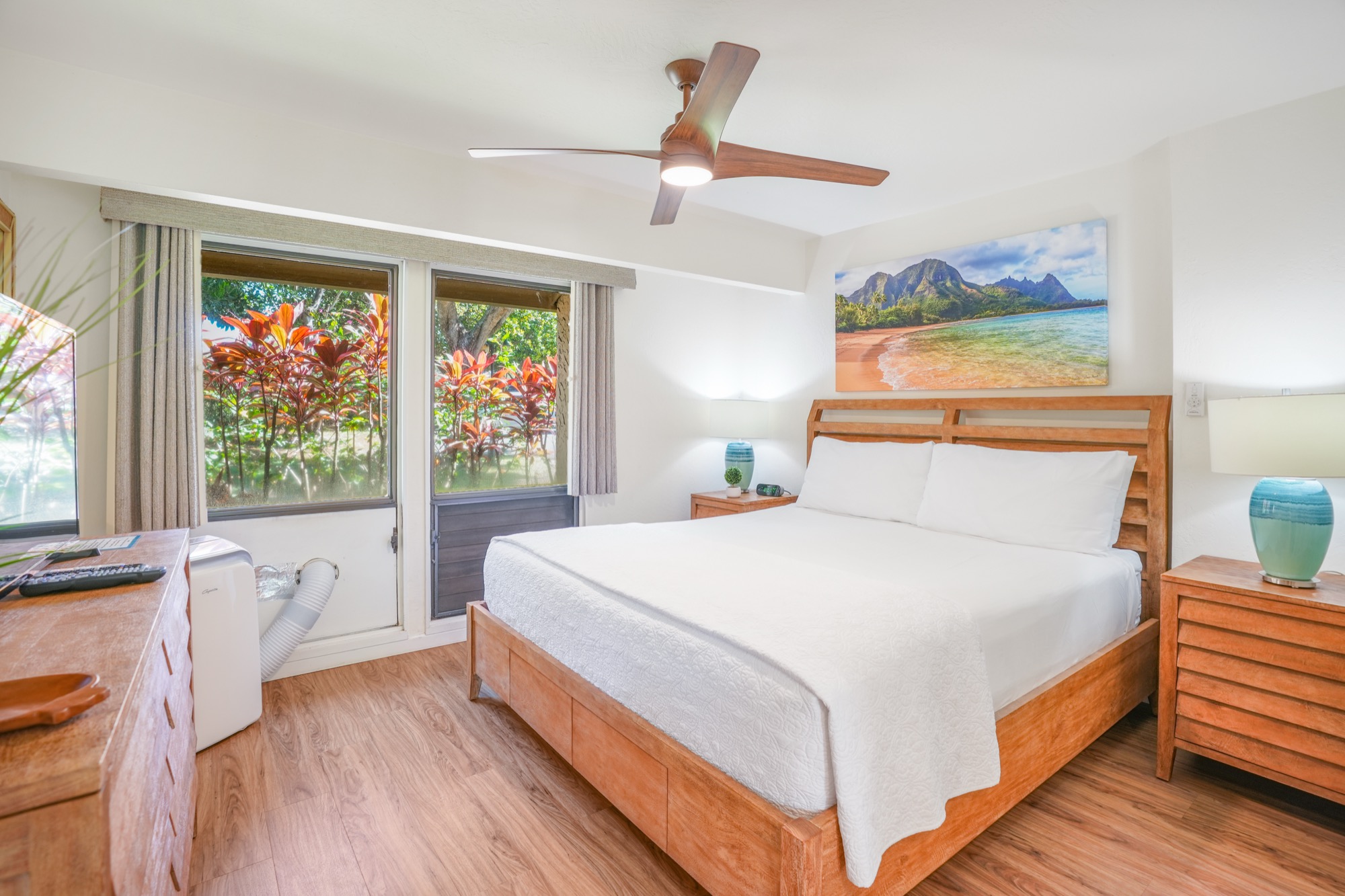 1901 Poipu Road, Unit 112 Koloa, HI 96756 - Photo 9 of 21 a bedroom with a large bed and a window