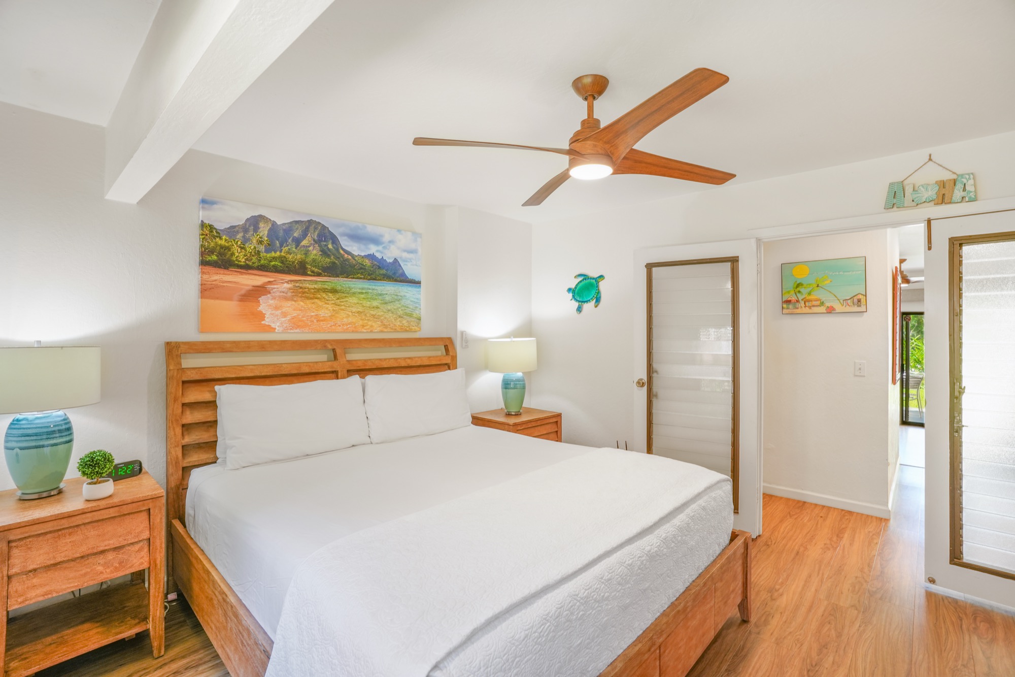 1901 Poipu Road, Unit 112 Koloa, HI 96756 - Photo 10 of 21 a bedroom with a bed and a window