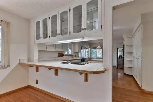 a kitchen with stainless steel appliances granite countertop a stove and a refrigerator
