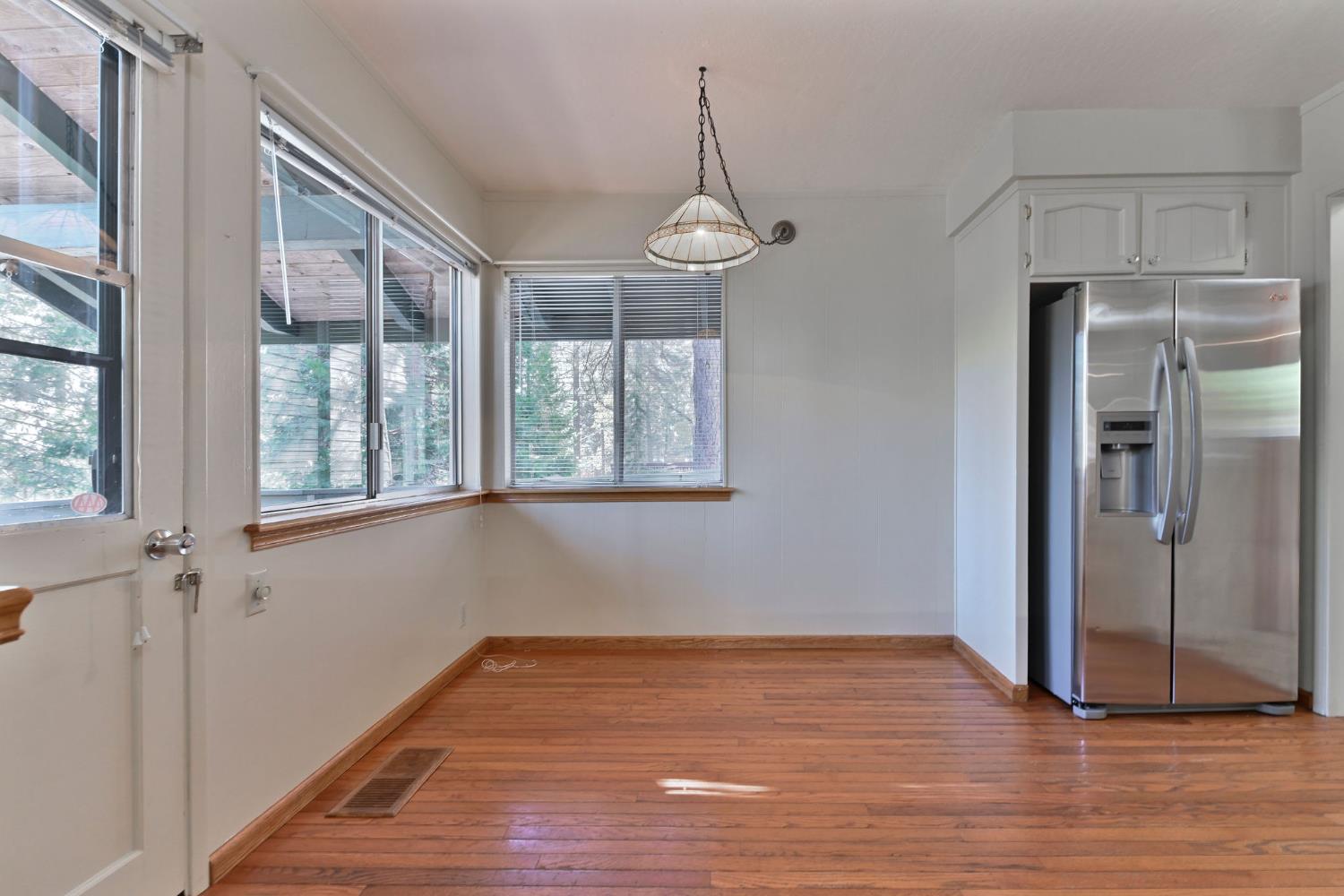 2637 Ruth Lane Arnold, CA 95223 - Photo 18 of 91 a view of empty room with wooden floor and fan