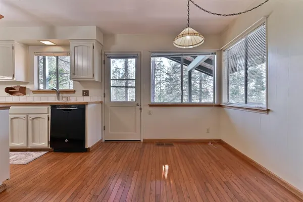 a view of room with wooden floor and window