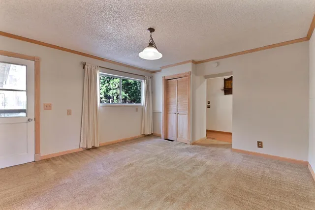 a view of room with wooden floor and window