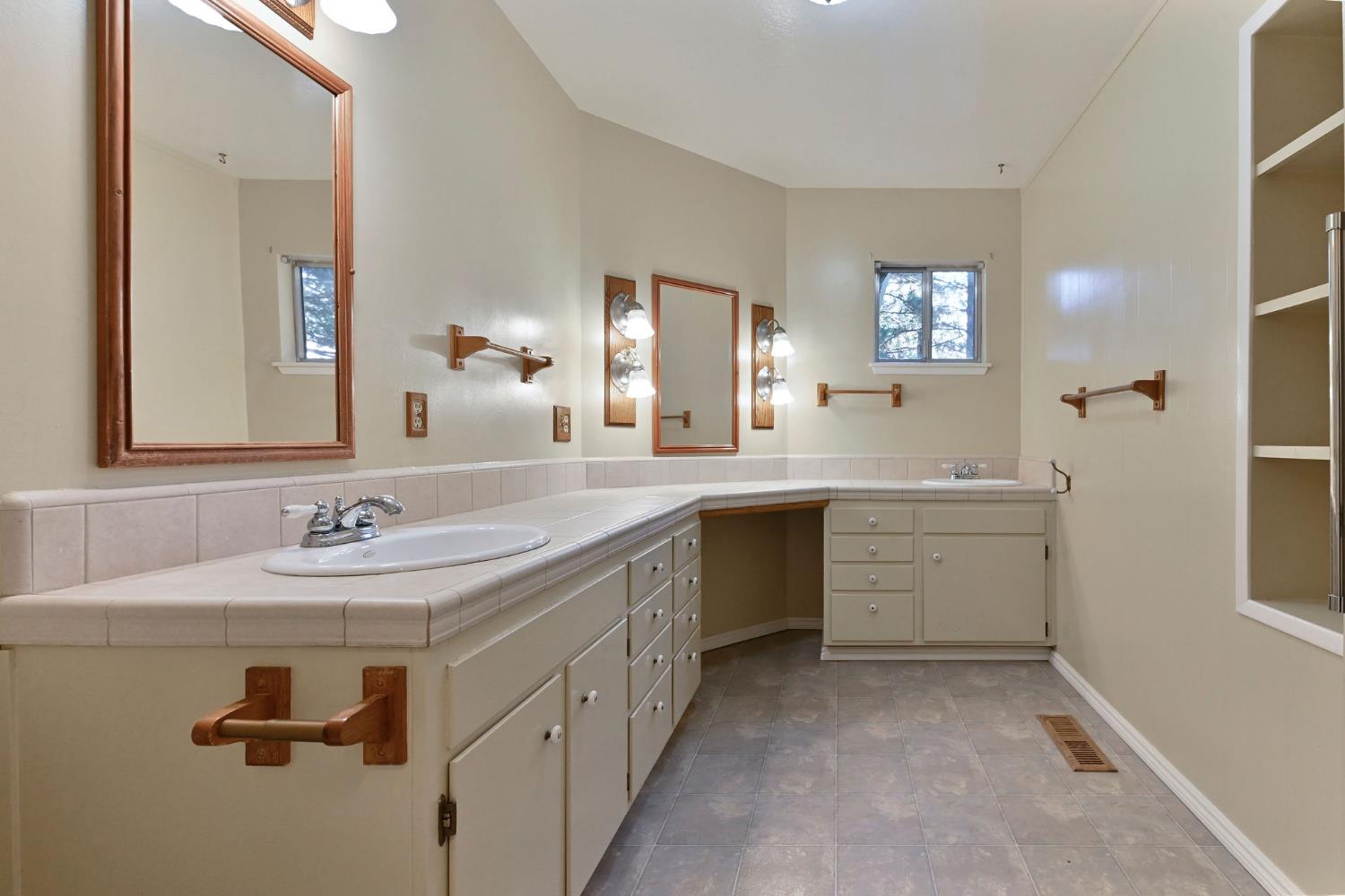 2637 Ruth Lane Arnold, CA 95223 - Photo 25 of 91 a spacious bathroom with a double vanity sink mirror and window