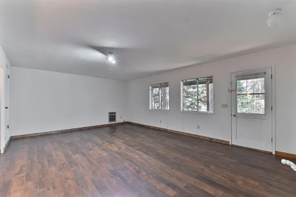 a view of outdoor space with wooden floor