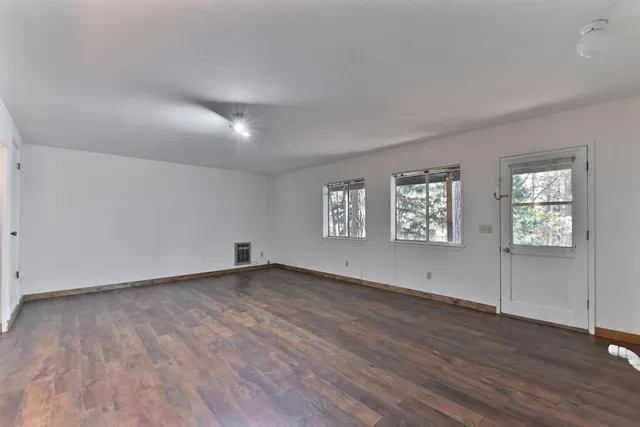 a view of outdoor space with wooden floor