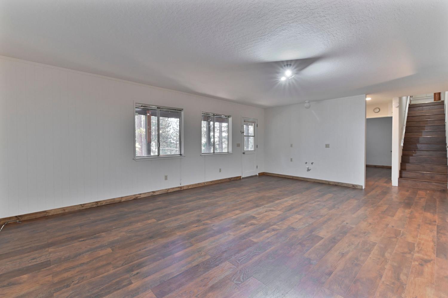 2637 Ruth Lane Arnold, CA 95223 - Photo 41 of 91 an empty room with wooden floor and windows