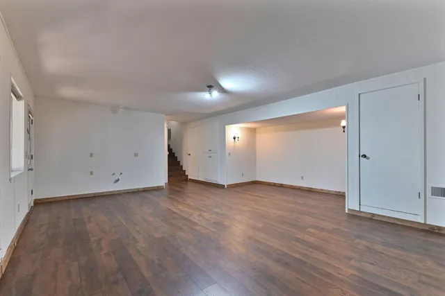 a view of a wooden balcony and trees