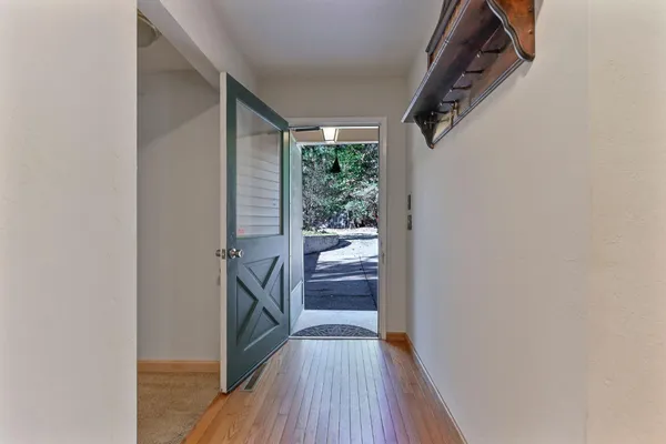 a view of an empty room with a fireplace