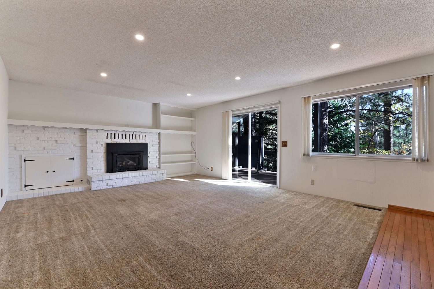 2637 Ruth Lane Arnold, CA 95223 - Photo 6 of 91 an empty room with windows and fireplace