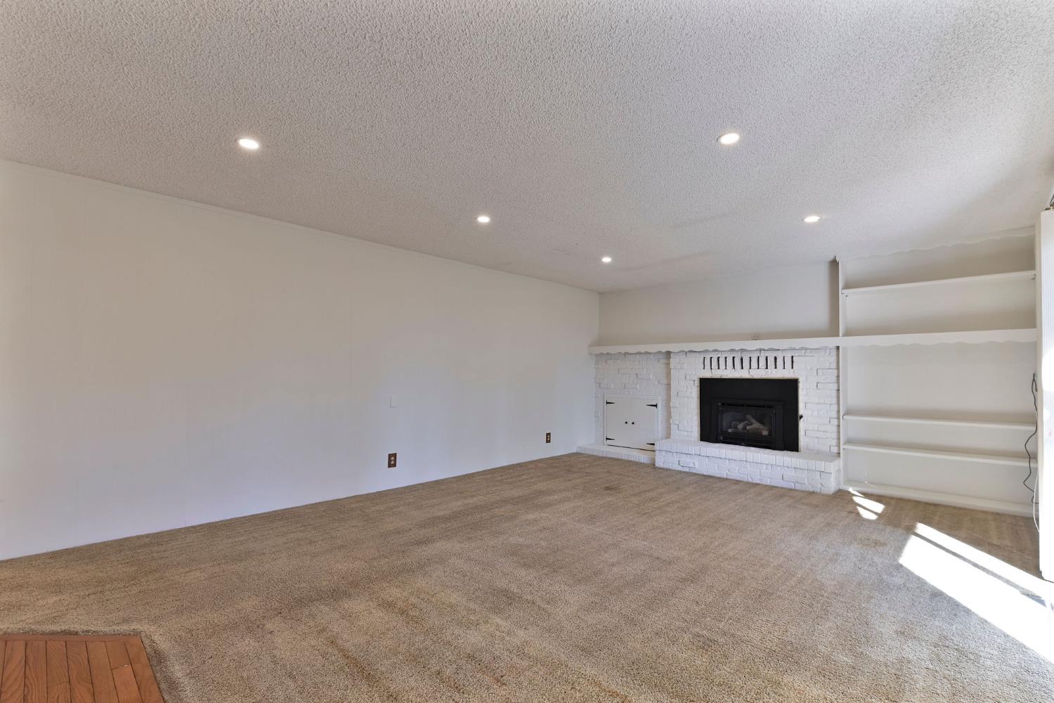 2637 Ruth Lane Arnold, CA 95223 - Photo 7 of 91 a view of an empty room with a fireplace