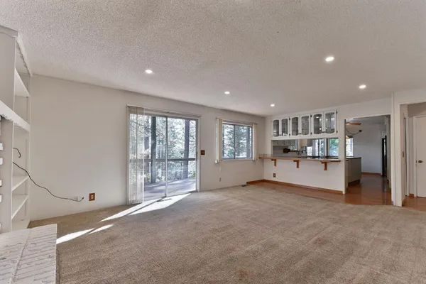 a kitchen with kitchen island a counter top space appliances and cabinets