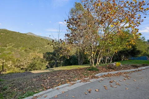 a view of a road with a building in the background