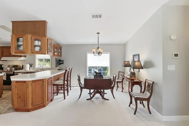 a kitchen with a sink stove top oven and cabinets