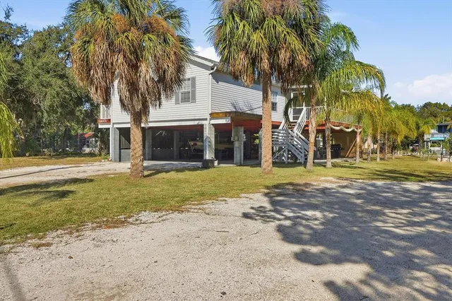 a view of balcony with wooden floor and yard