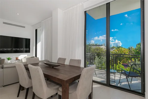 a view of a dining room with furniture window and outside view