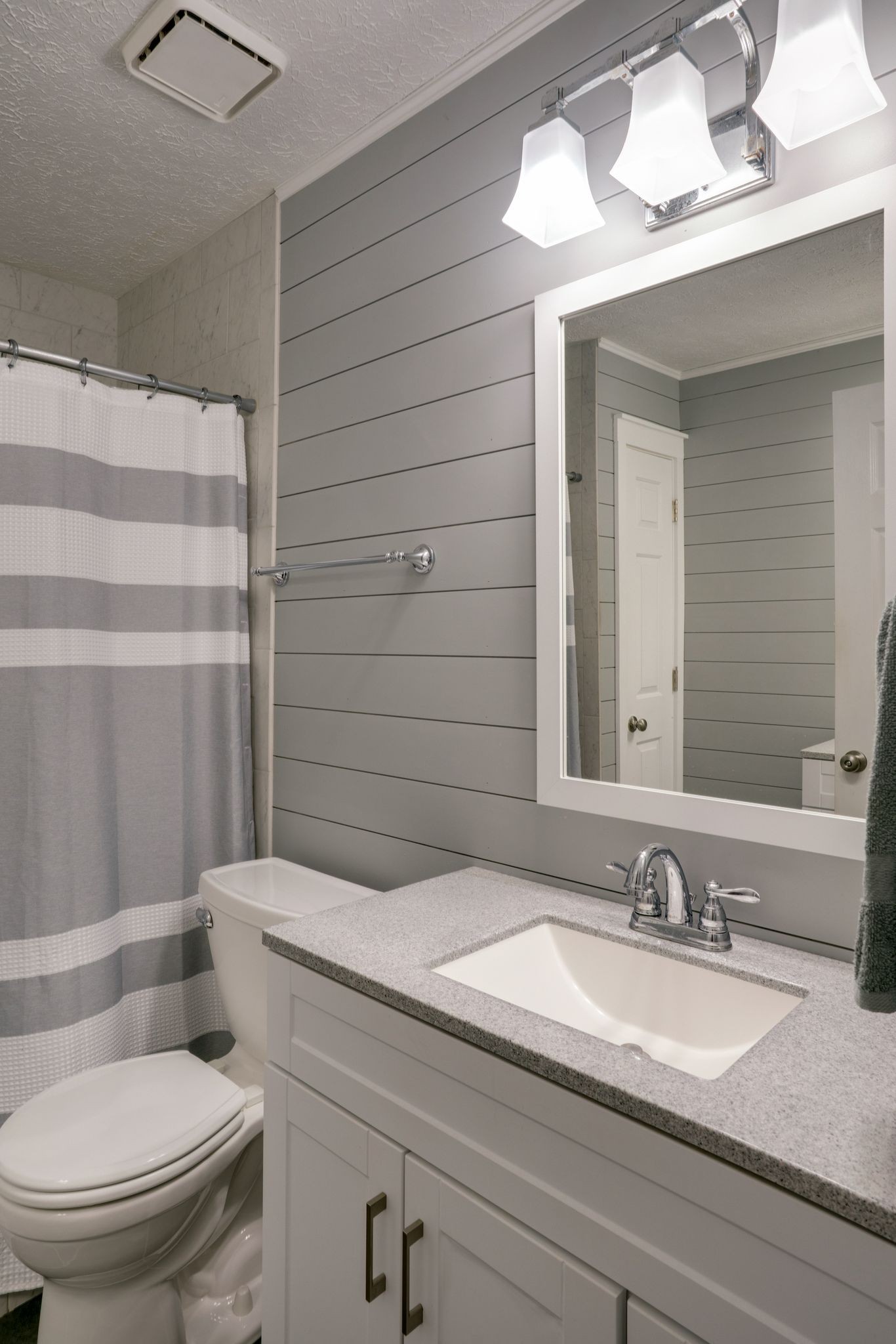 145 South Palmers Chapel Road White House, TN 37188 - Photo 11 of 30 a bathroom with a granite countertop sink vanity mirror and toilet