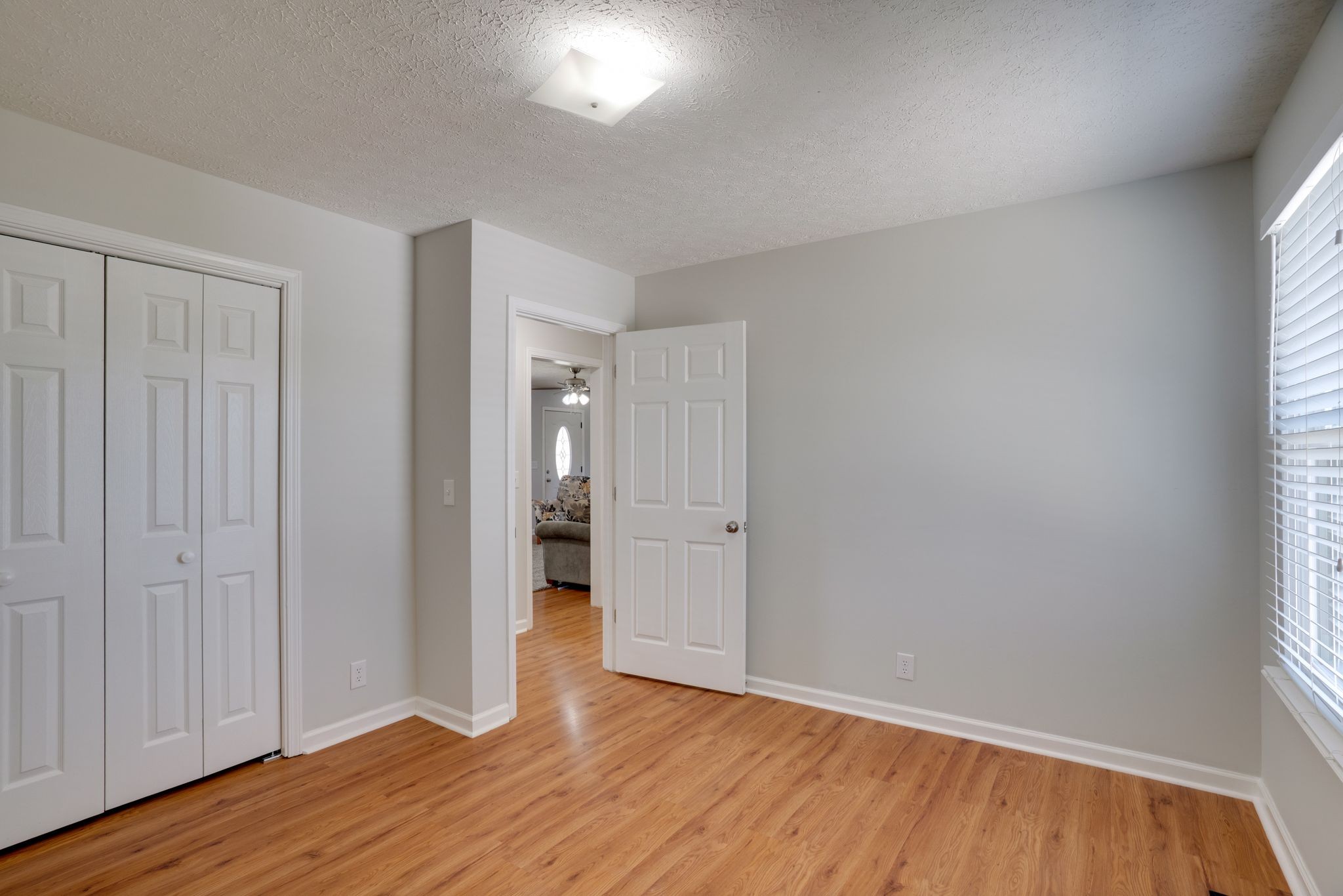 145 South Palmers Chapel Road White House, TN 37188 - Photo 14 of 30 an empty room with wooden floor and windows