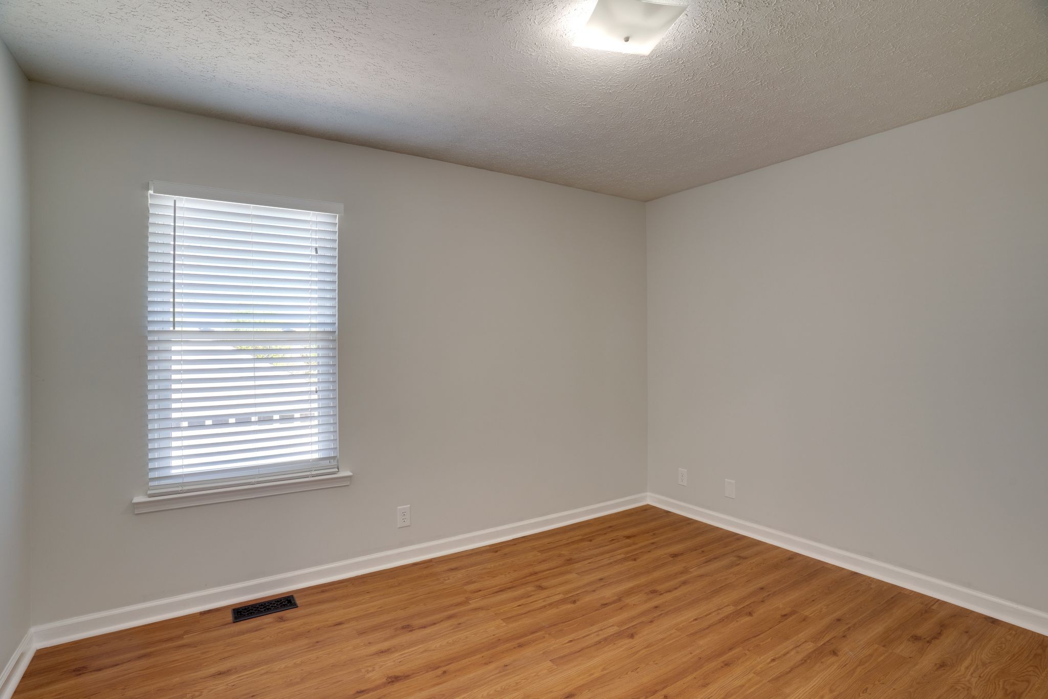 145 South Palmers Chapel Road White House, TN 37188 - Photo 15 of 30 a view of an empty room with wooden floor and a window