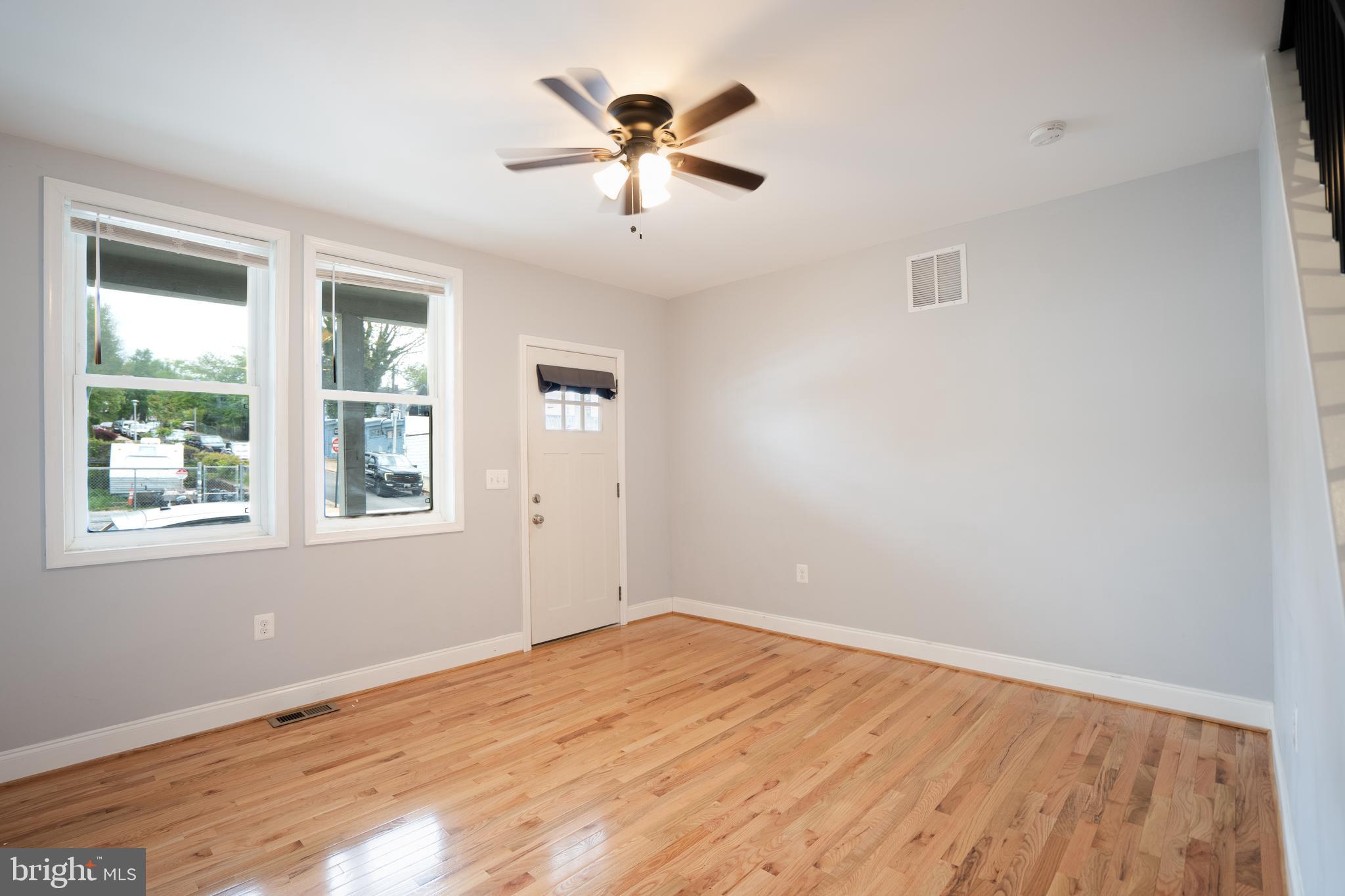 3804 Falls Road Baltimore, MD 21211 - Photo 2 of 18 wooden floor in an empty room with a window