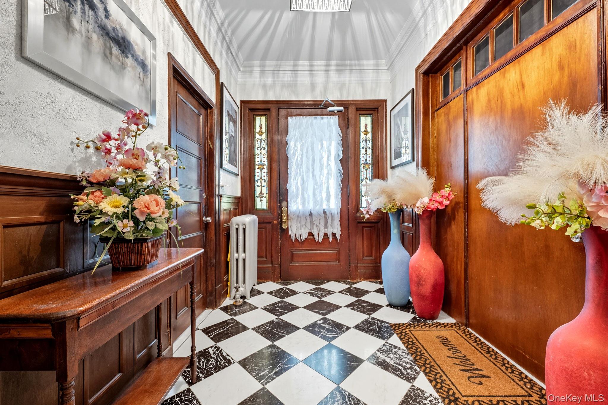 165 Park Avenue, Unit 2 Mount Vernon, NY 10550 - Photo 17 of 20 a dining room filled with furniture and flowers