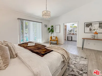 a bedroom with bed and window