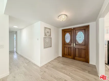 a view of a hallway with elevator