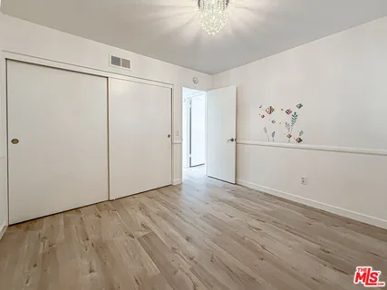 a view of a hardwood floor in a room