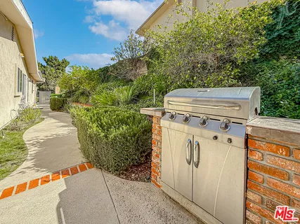 a view of a backyard with pathway