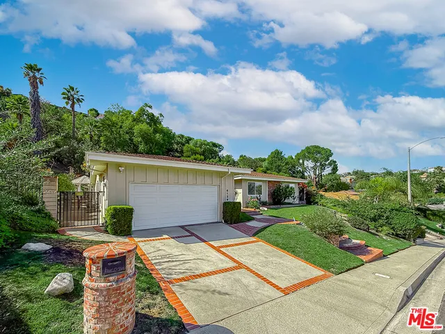 a view of house with outdoor space and entertaining space