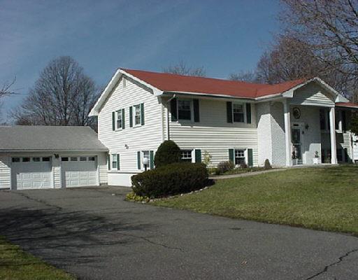 9 Cottontail Road Norwalk, CT 06854 - Photo 1 of 1 a front view of a house with a yard