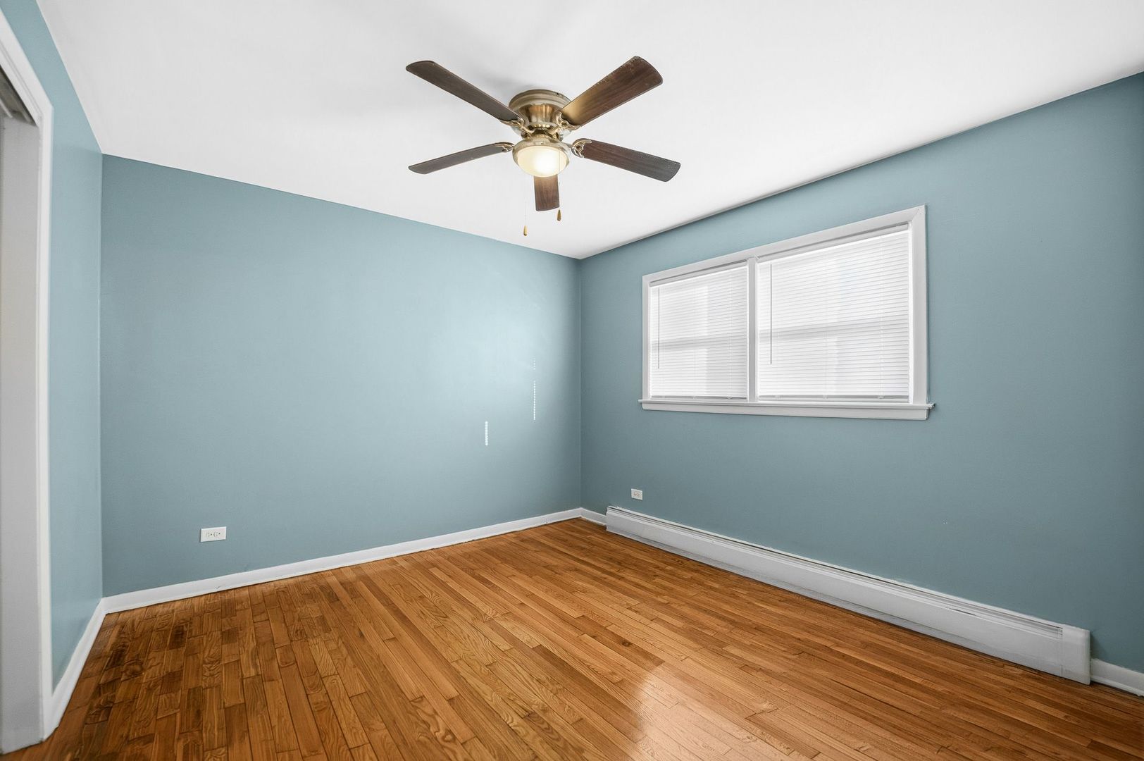 9209 South State Street Chicago, IL 60619 - Photo 7 of 20 a view of a big room with wooden floor and windows