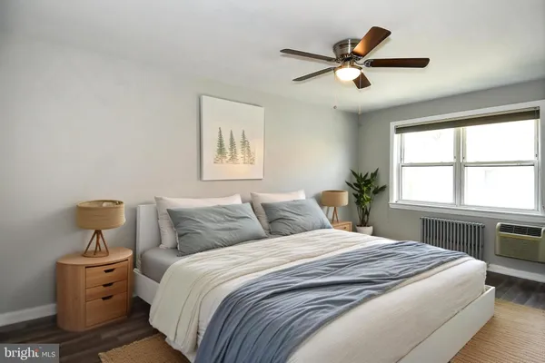 a bedroom with a bed and window