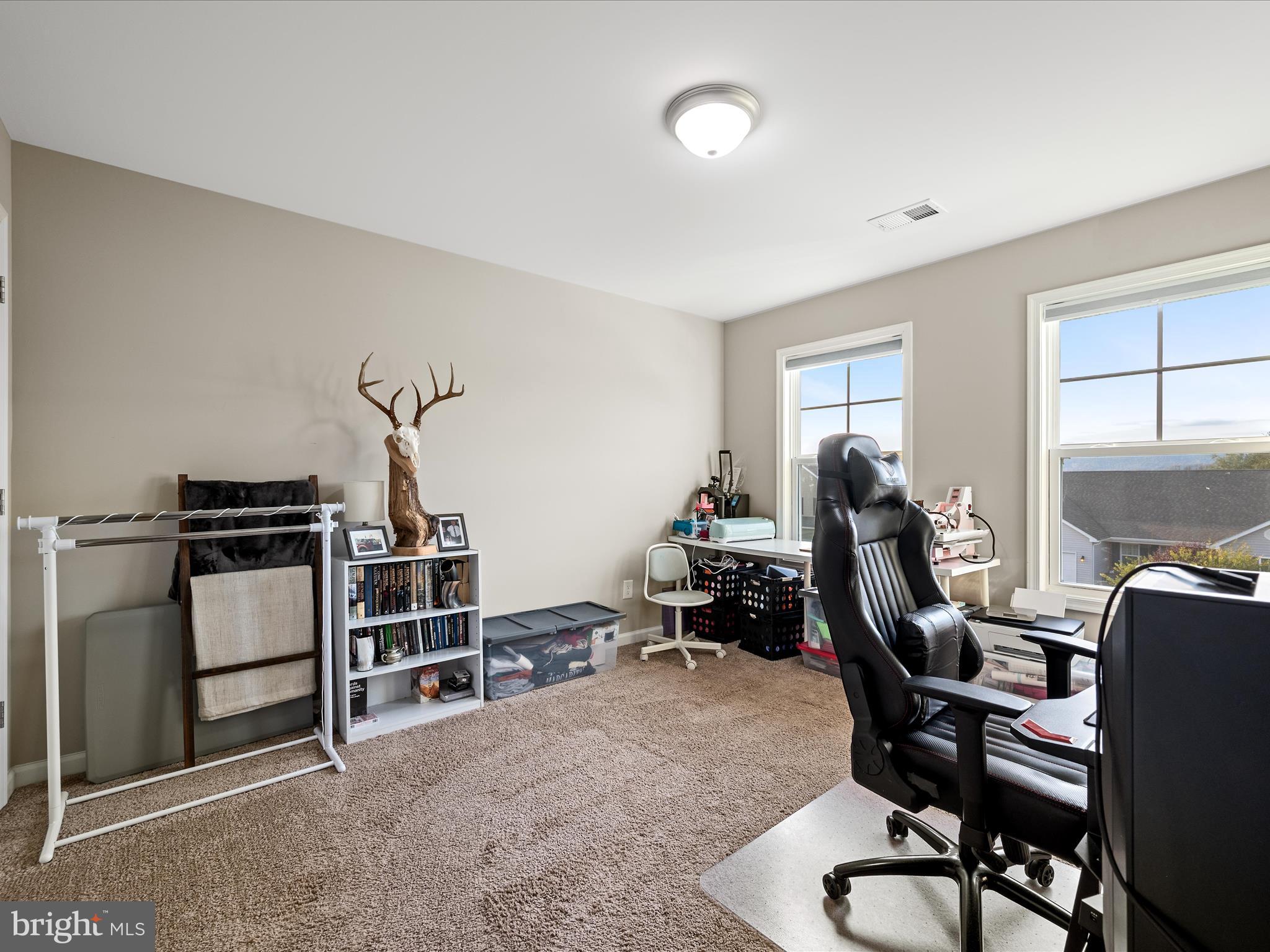 156 Reprisal Road Inwood, WV 25428 - Photo 28 of 49 a view of a workspace with furniture and a window