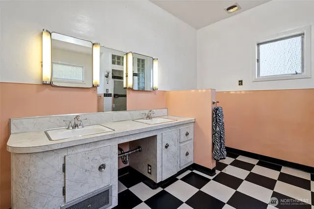 a room with a sink and a mirror