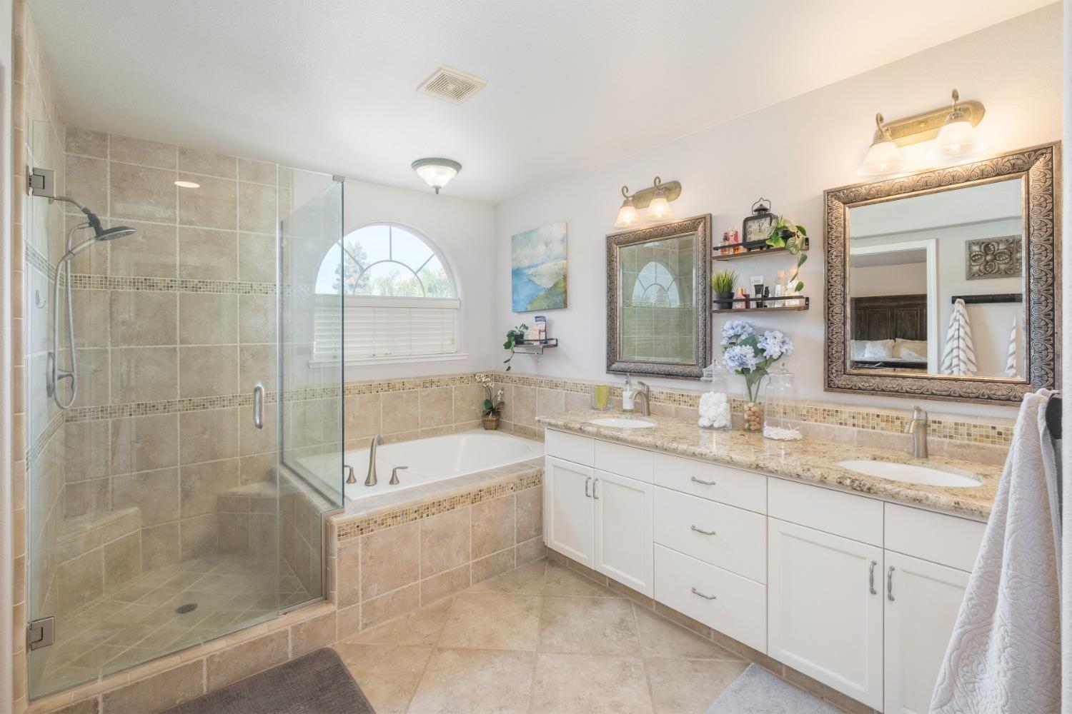452 Omaha Avenue Clovis, CA 93619 - Photo 20 of 33 a bathroom with a sink double vanity granite tub and shower
