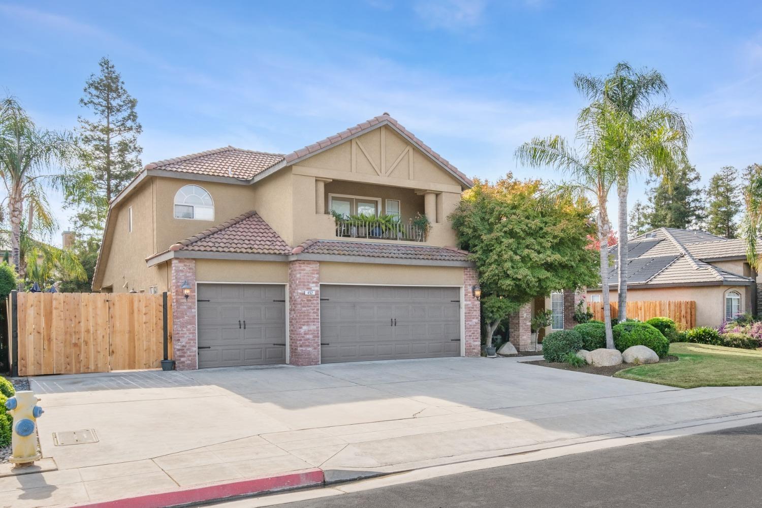 452 Omaha Avenue Clovis, CA 93619 - Photo 2 of 33 front view of a house with a yard and a garage