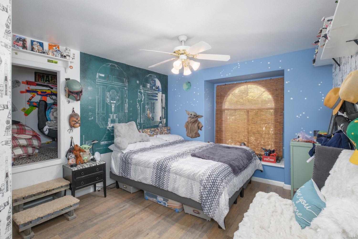 452 Omaha Avenue Clovis, CA 93619 - Photo 21 of 33 a bedroom with a bed furniture and a window