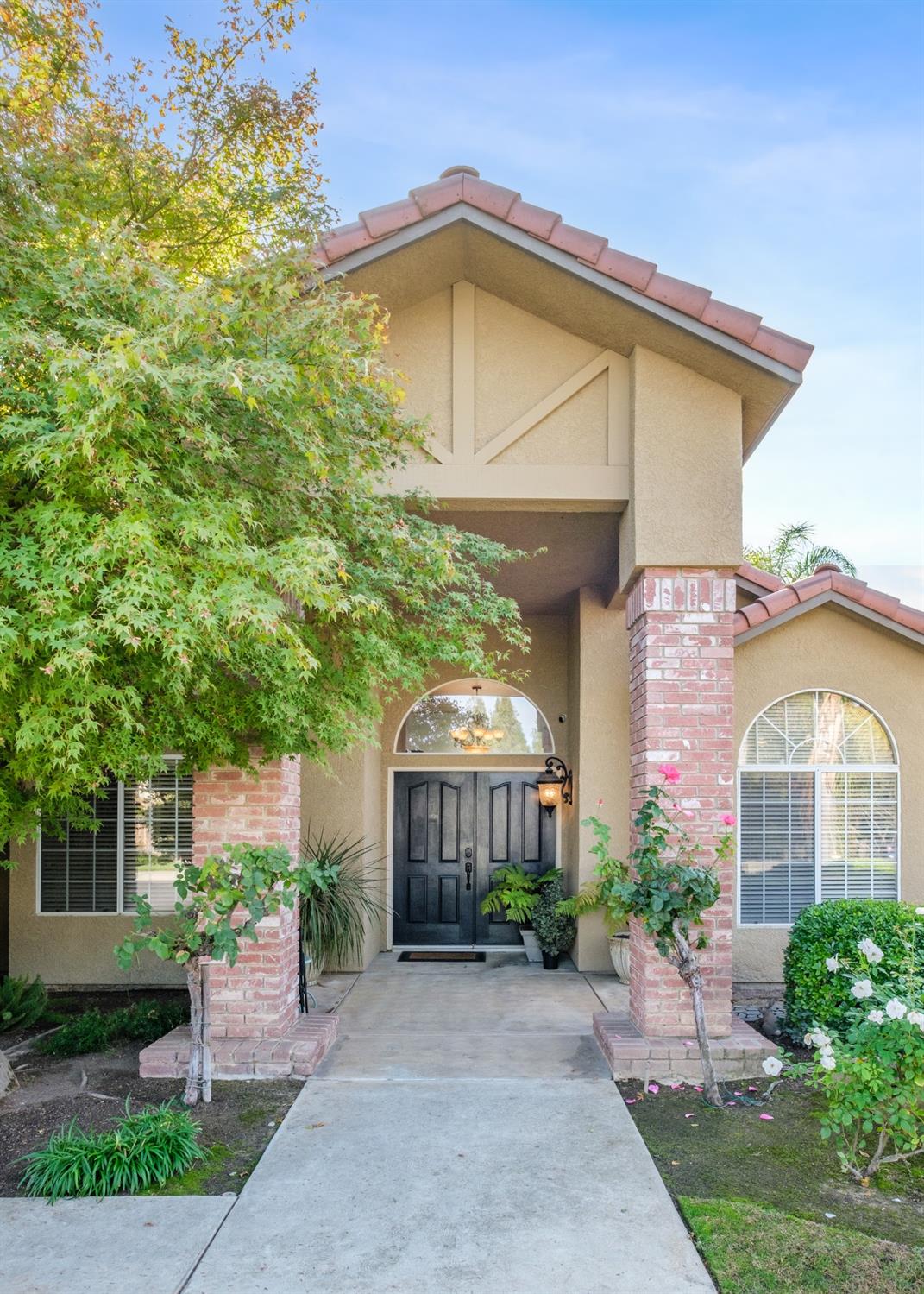 452 Omaha Avenue Clovis, CA 93619 - Photo 3 of 33 a front view of a house with garden