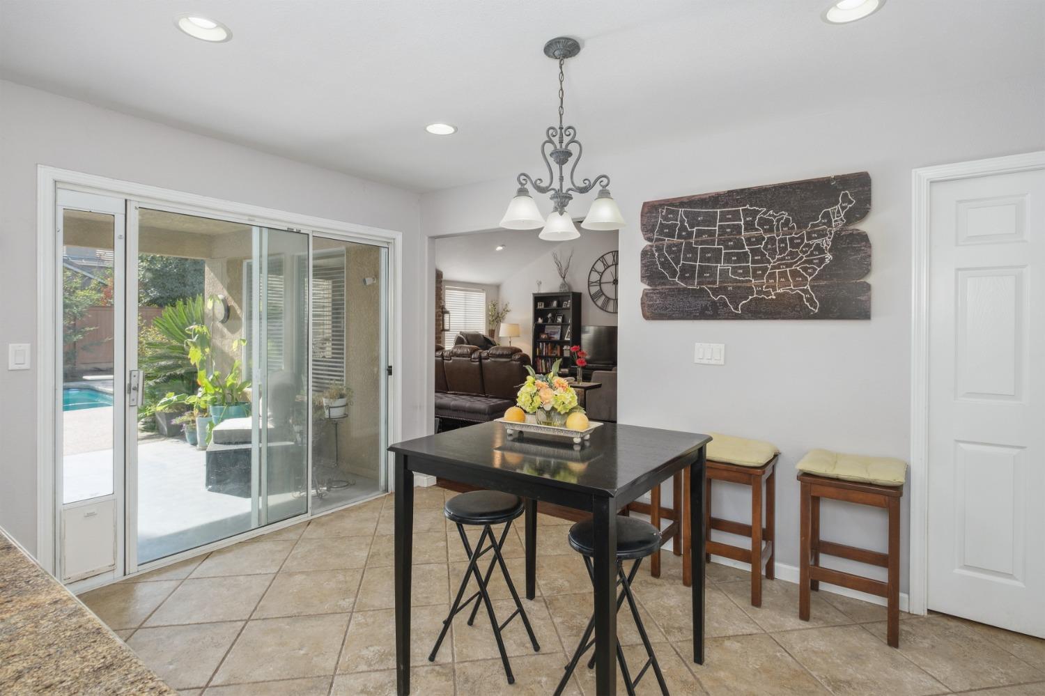 452 Omaha Avenue Clovis, CA 93619 - Photo 10 of 33 a view of a dining room with furniture window and outside view