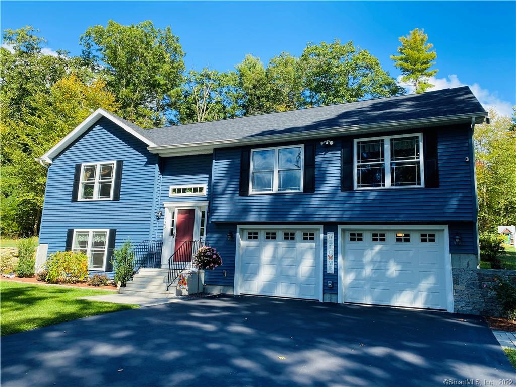 723 Quaddick Town Farm Road Thompson, CT 06277 - Photo 1 of 1 a front view of a house with a yard