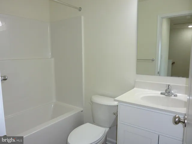 a bathroom with a sink toilet and bathtub