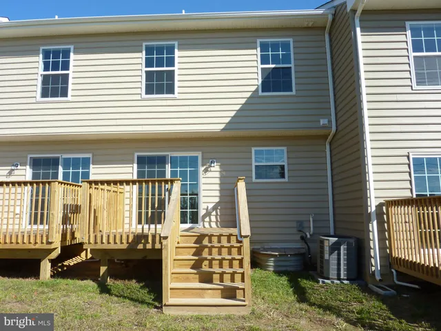 a view of a garden with a building in the background