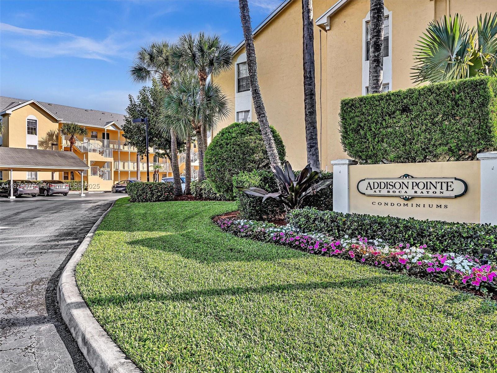 6340 La Costa Drive, Unit B Boca Raton, FL 33433 - Photo 13 of 16 a sign on the side of the road