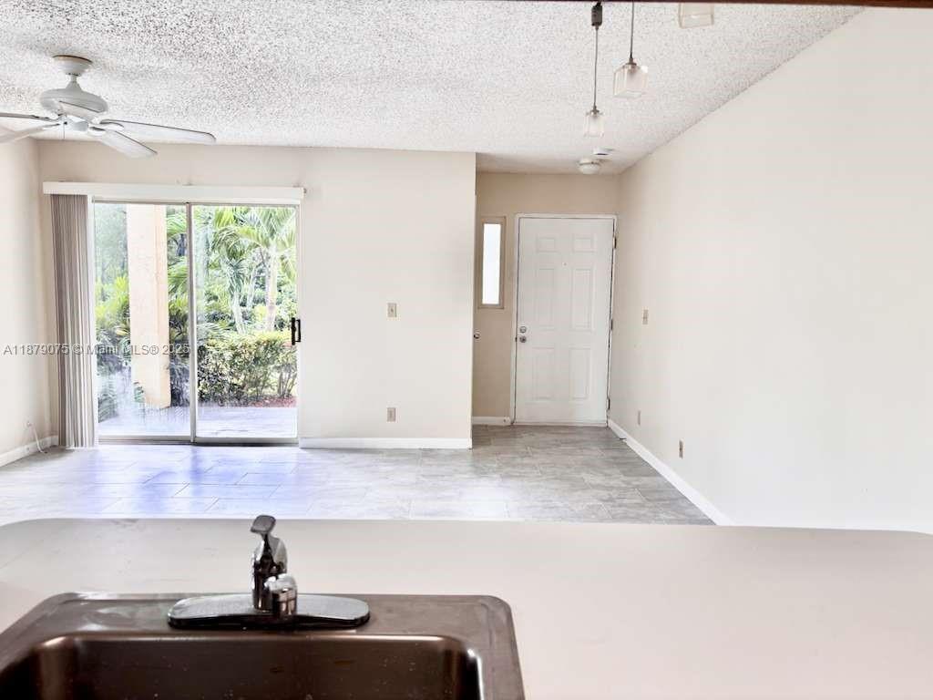6340 La Costa Drive, Unit B Boca Raton, FL 33433 - Photo 4 of 16 a bathroom with a sink and a mirror